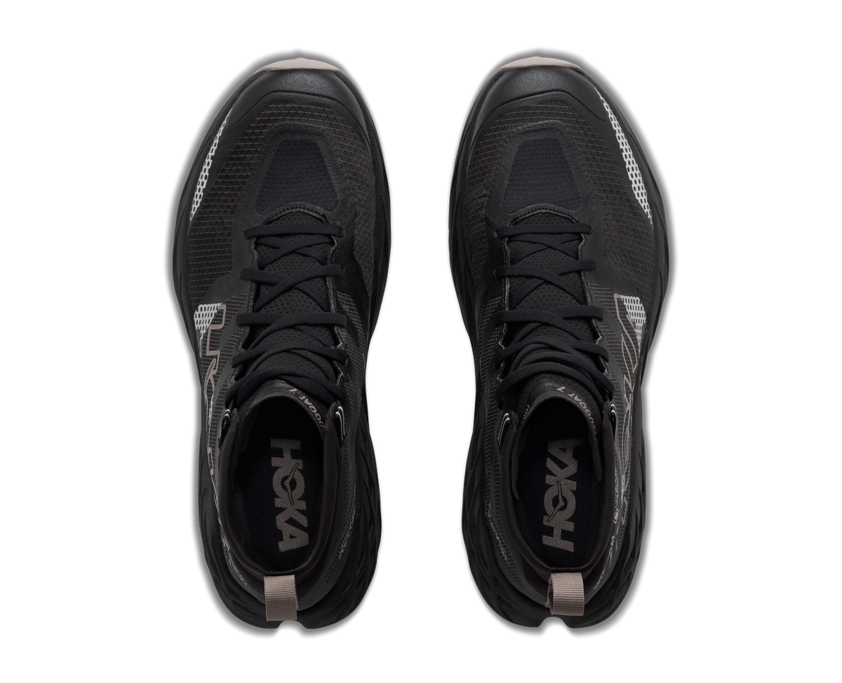 A pair of black HOKA athletic shoes shown from a top-down view on a white background.