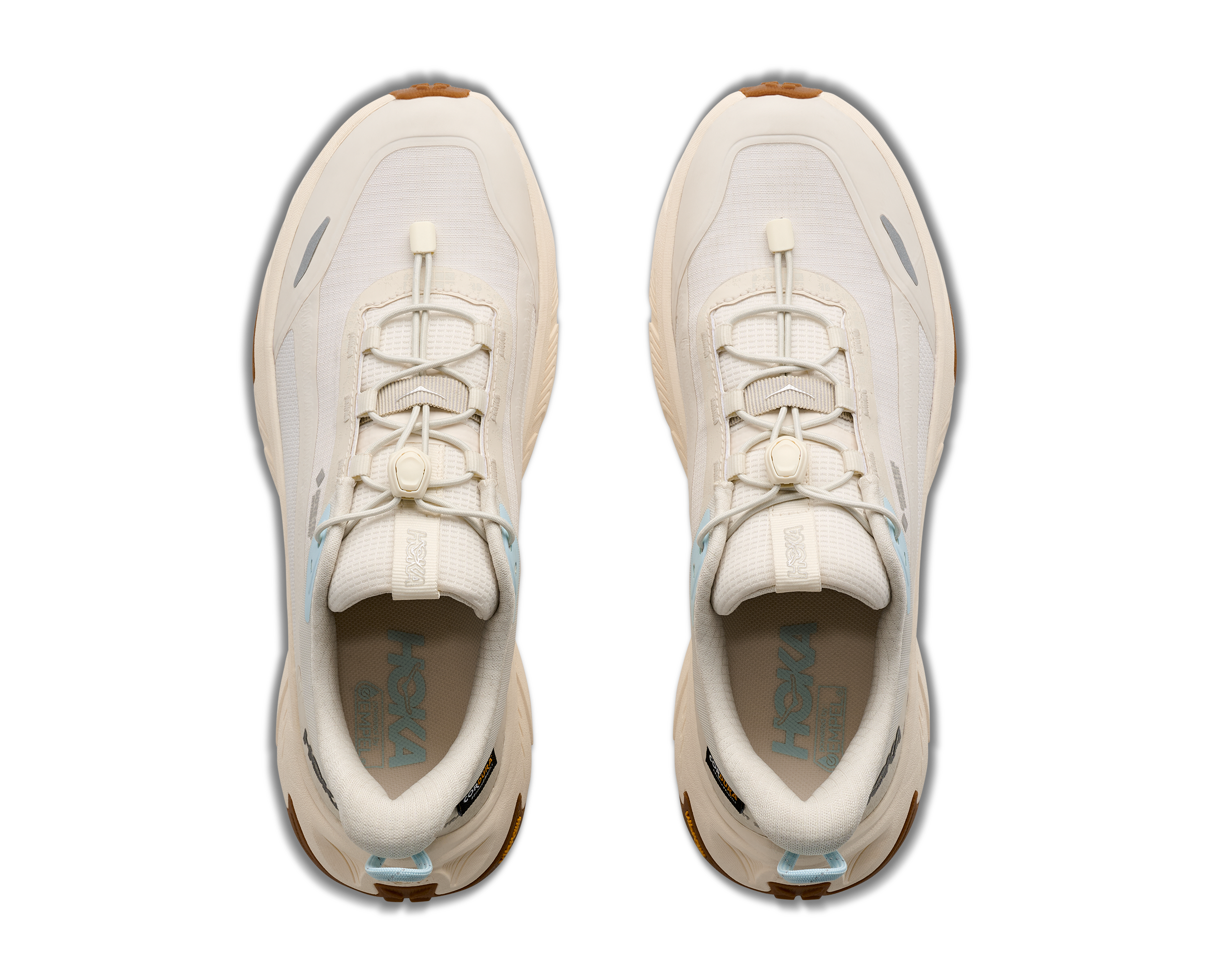 A pair of off-white Hoka sneakers shown from a top-down view against a solid white background.