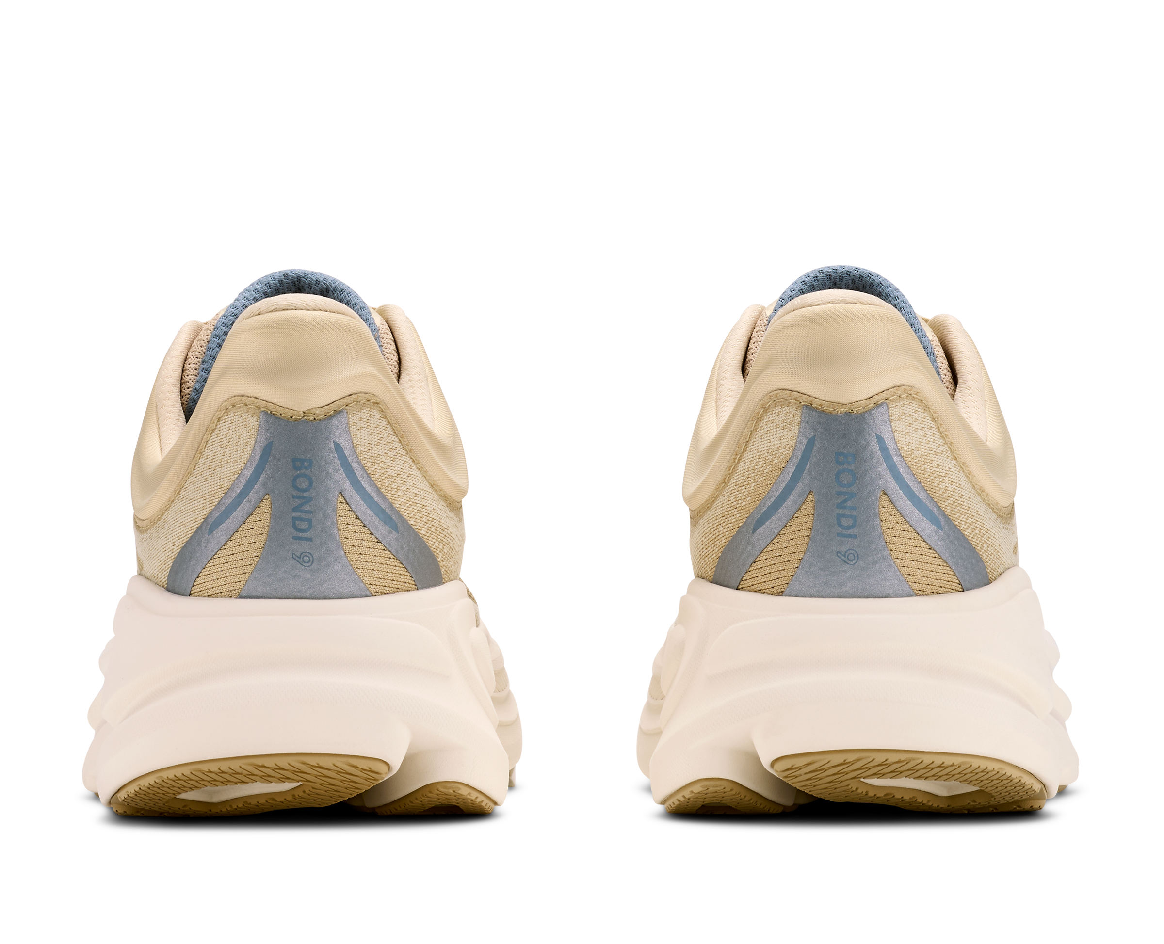 Pair of beige running shoes with blue accents on a white background