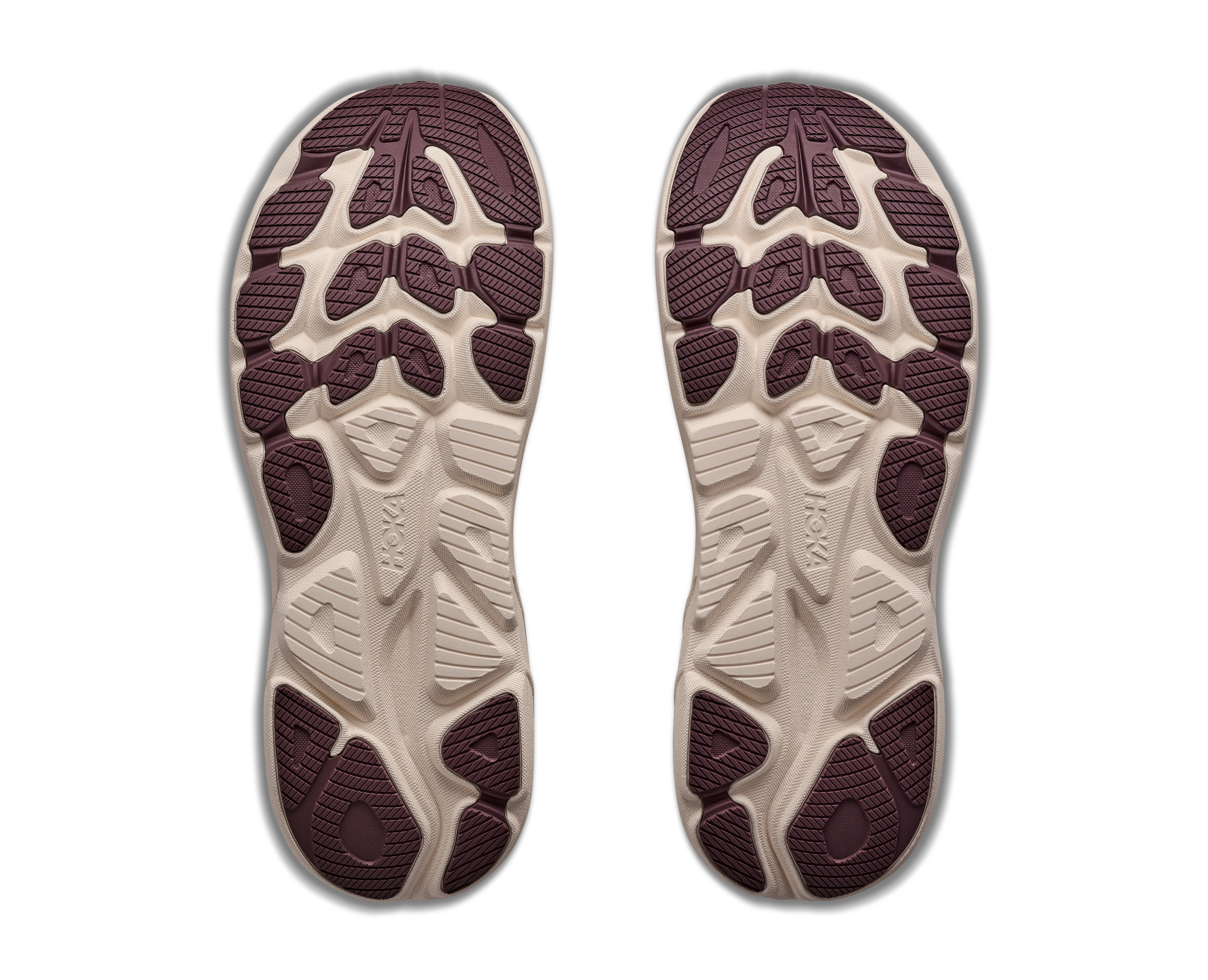 Pair of shoe soles with a textured pattern on a white background