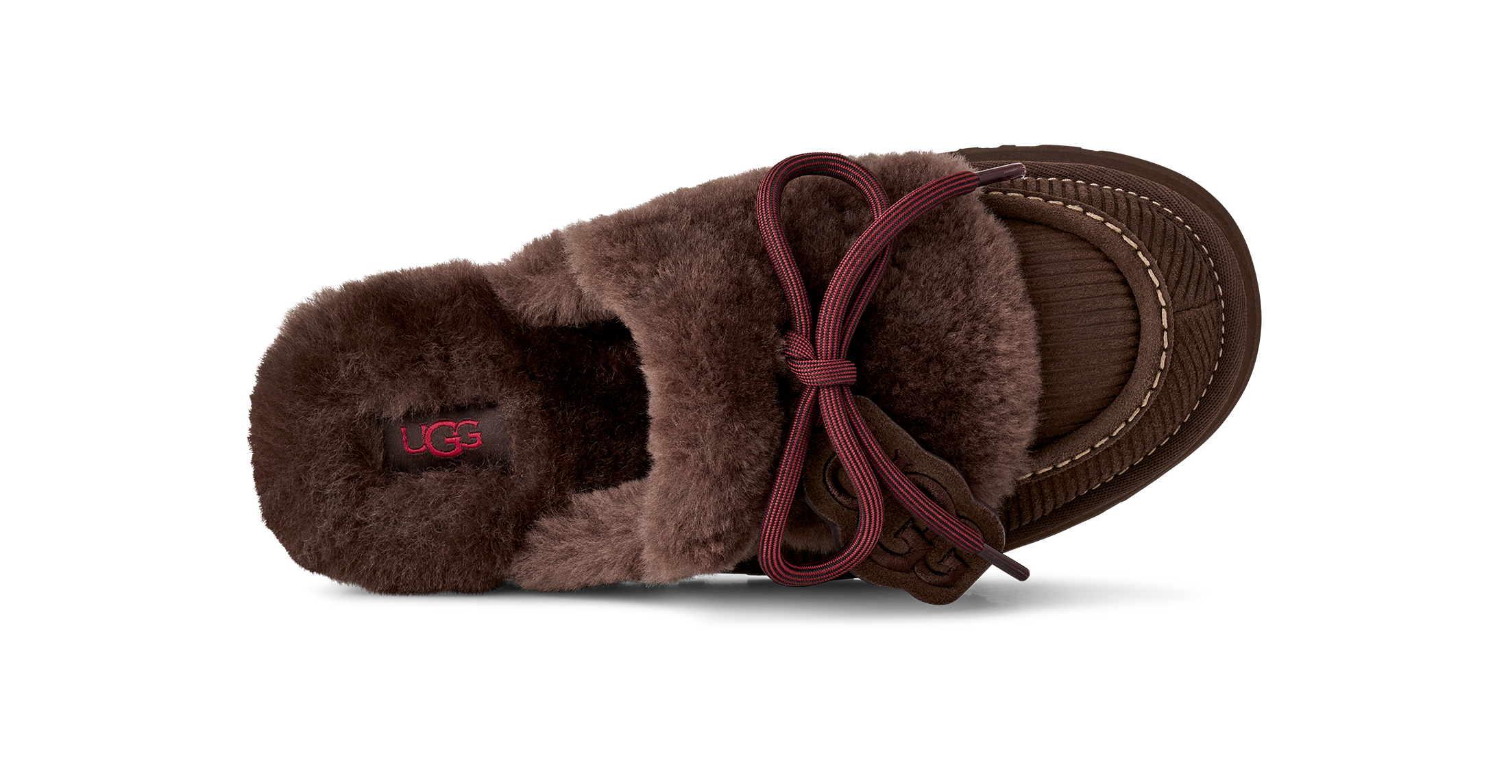 Brown UGG slipper with a bow on a white background
