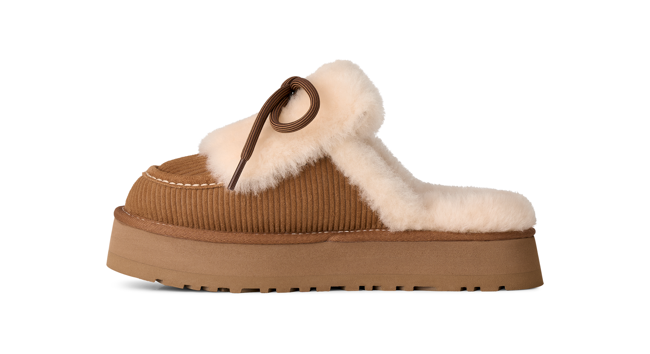 A single platform slipper in tan corduroy with a fluffy cream shearling lining and a brown leather strap detail, shown from a side profile on a white background.