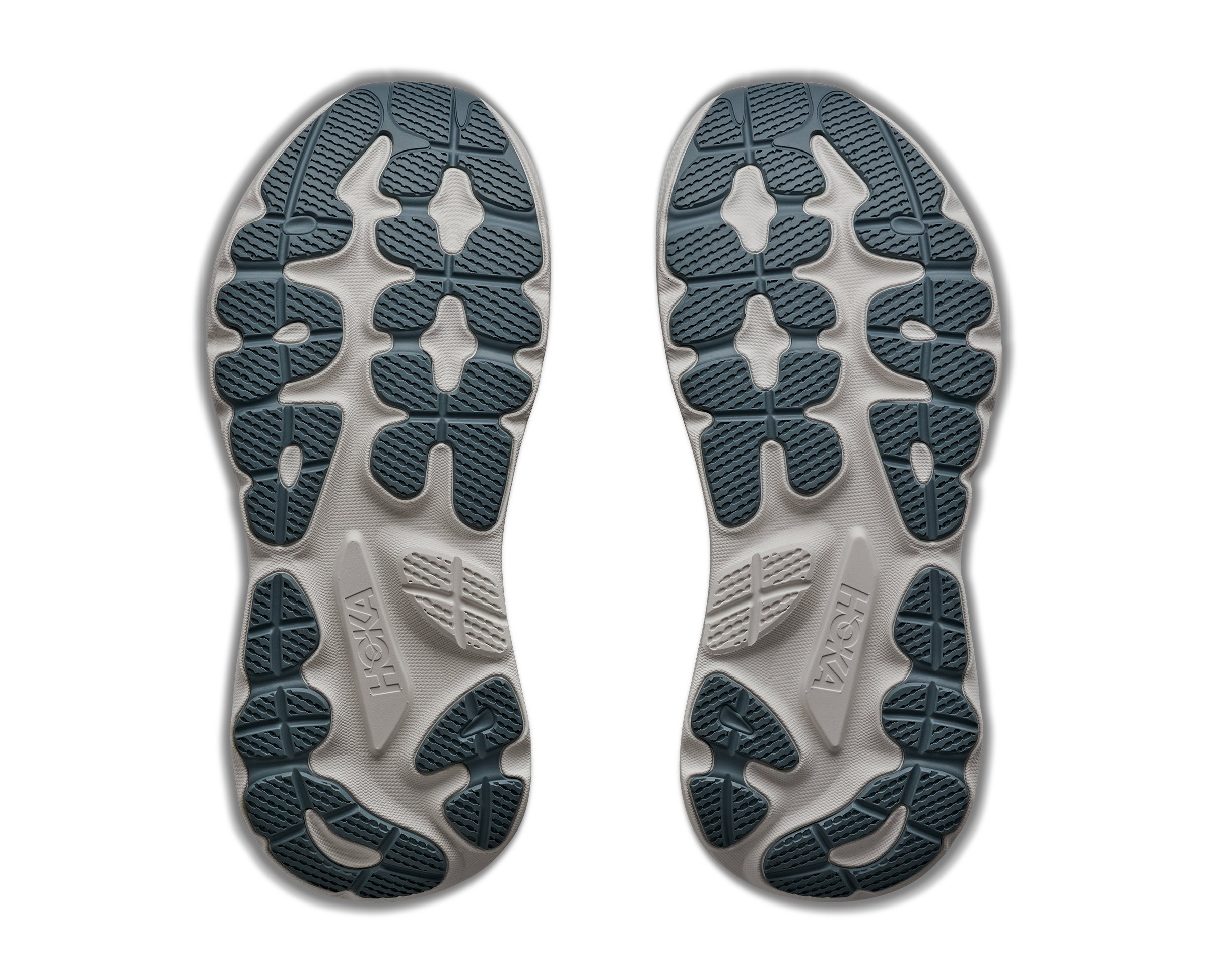 Close-up of the sole of a shoe with visible branding on a white background