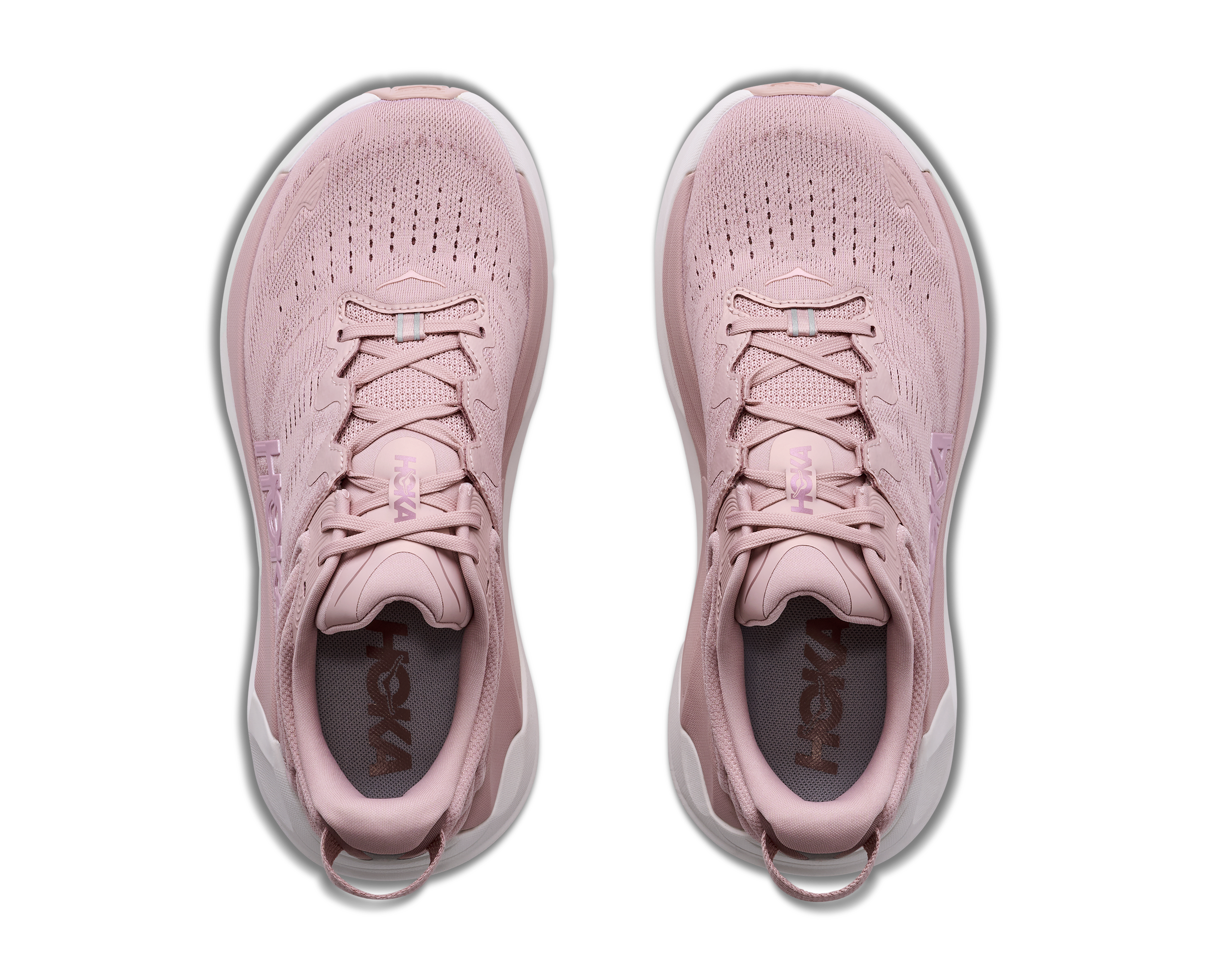 Pair of pink running shoes on a white background