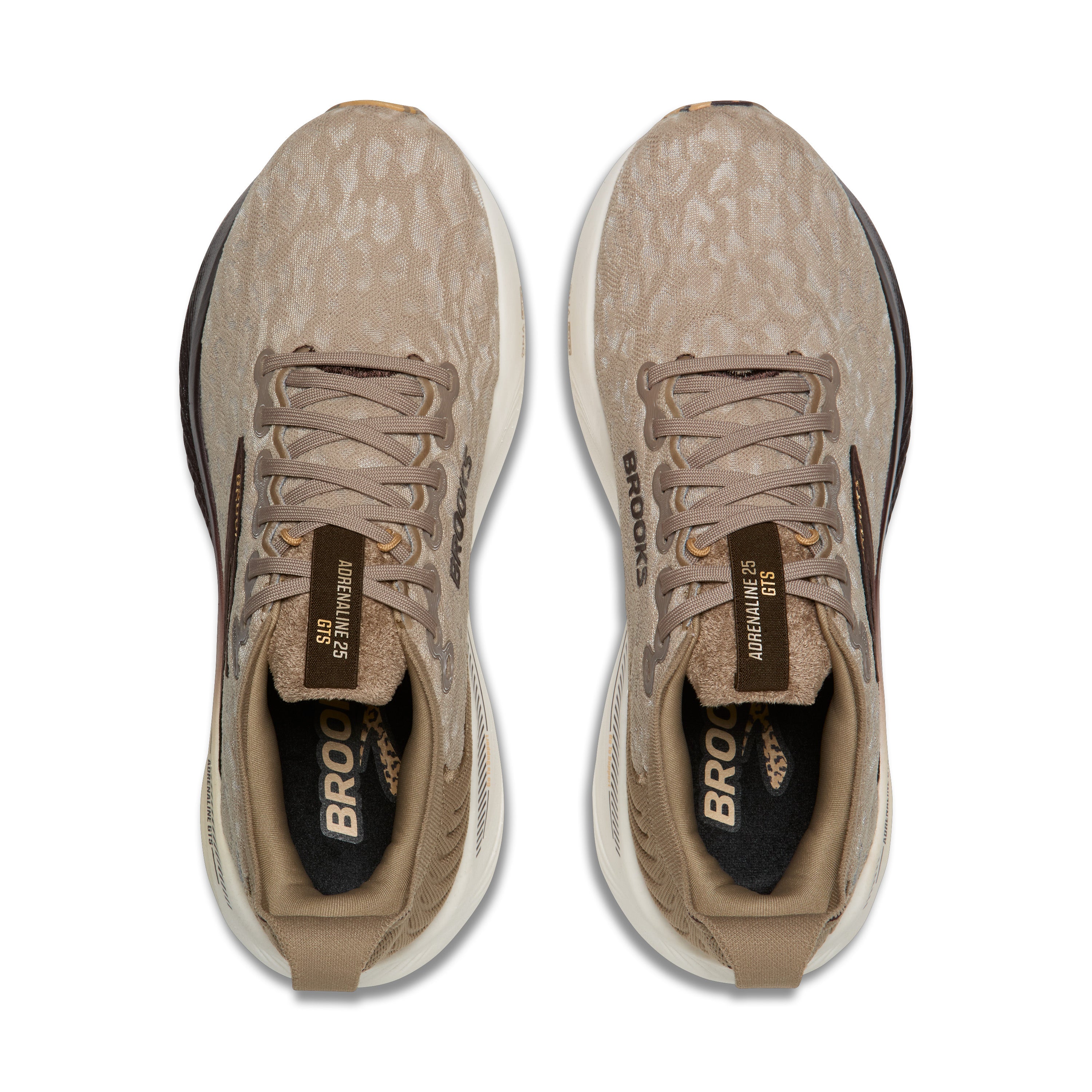 Pair of brown running shoes with visible branding on a white background