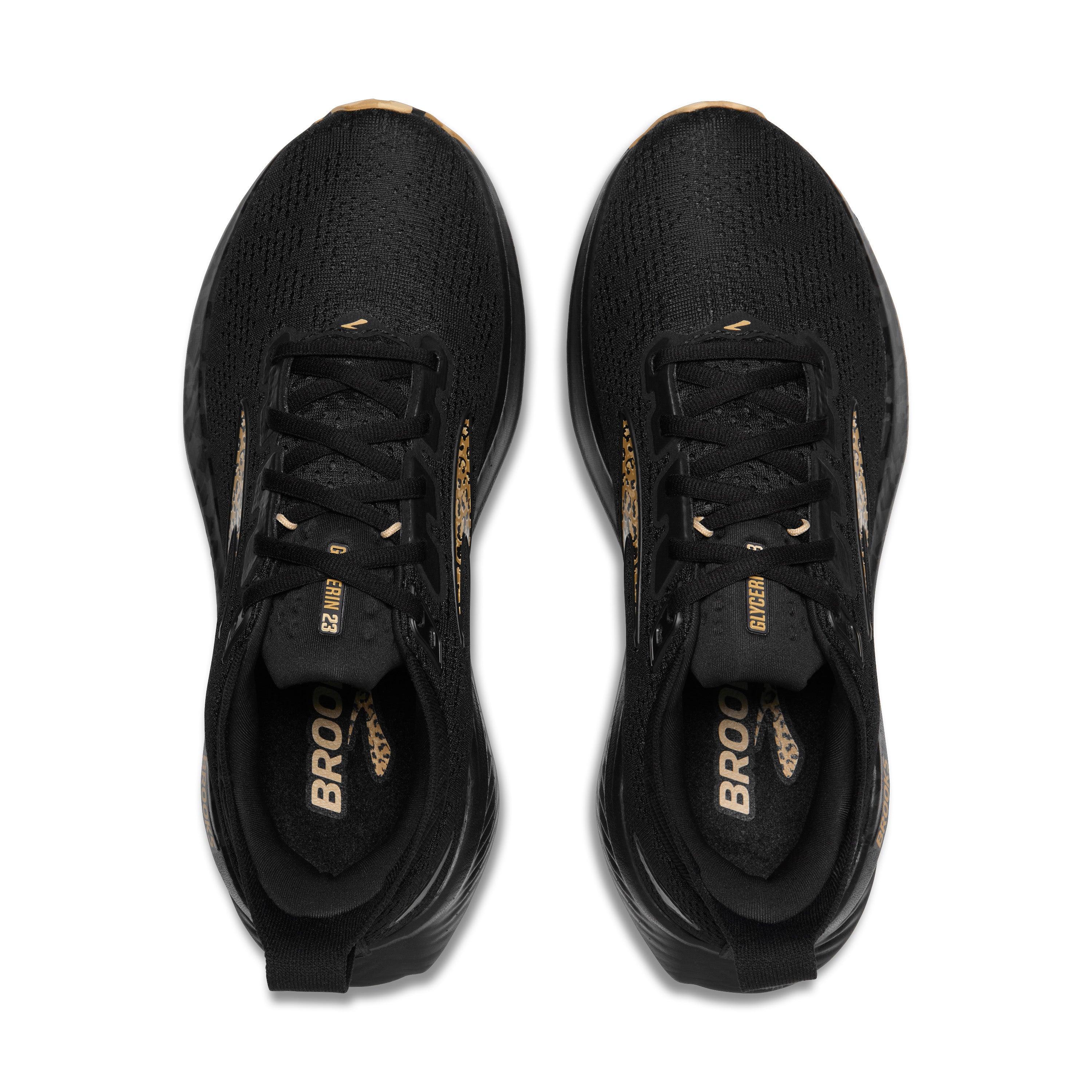 Black running shoes with gold accents on a white background
