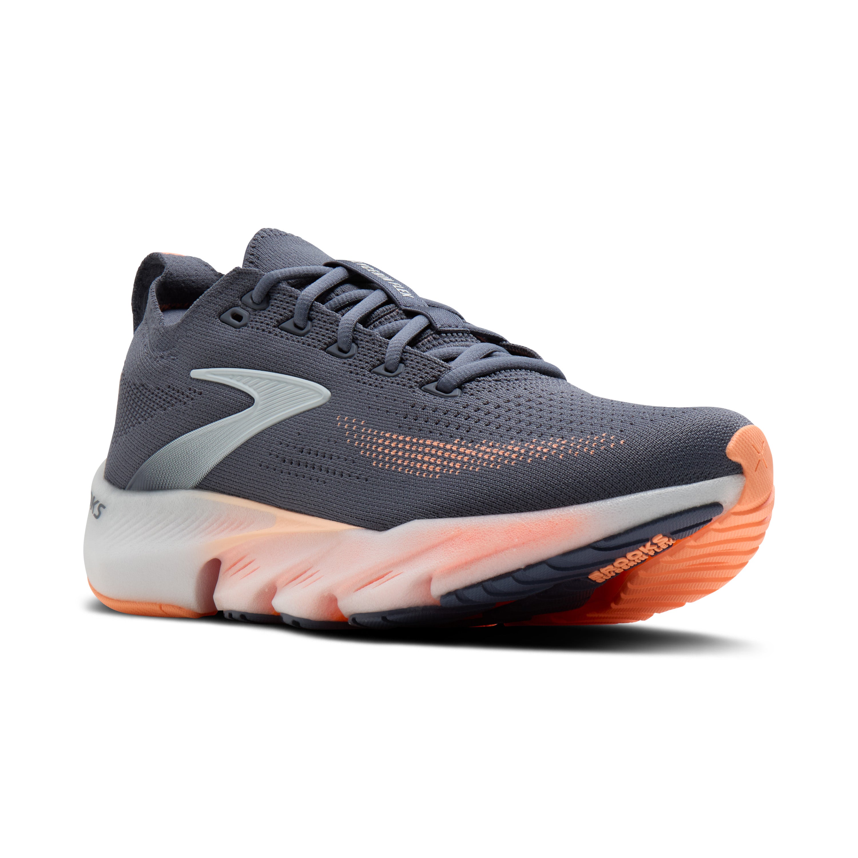 Gray running shoe with orange sole on a white background