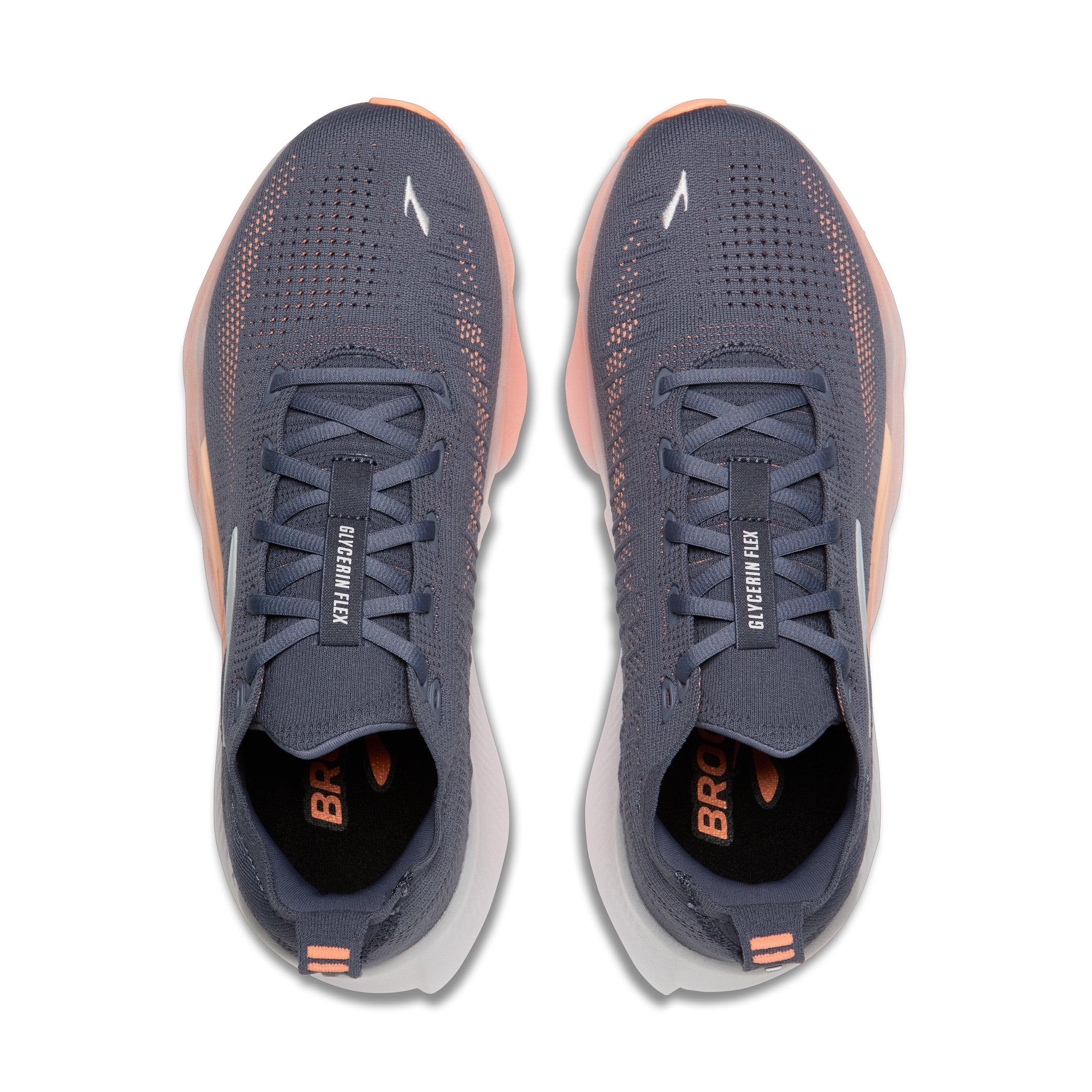 Pair of blue running shoes with orange accents on a white background