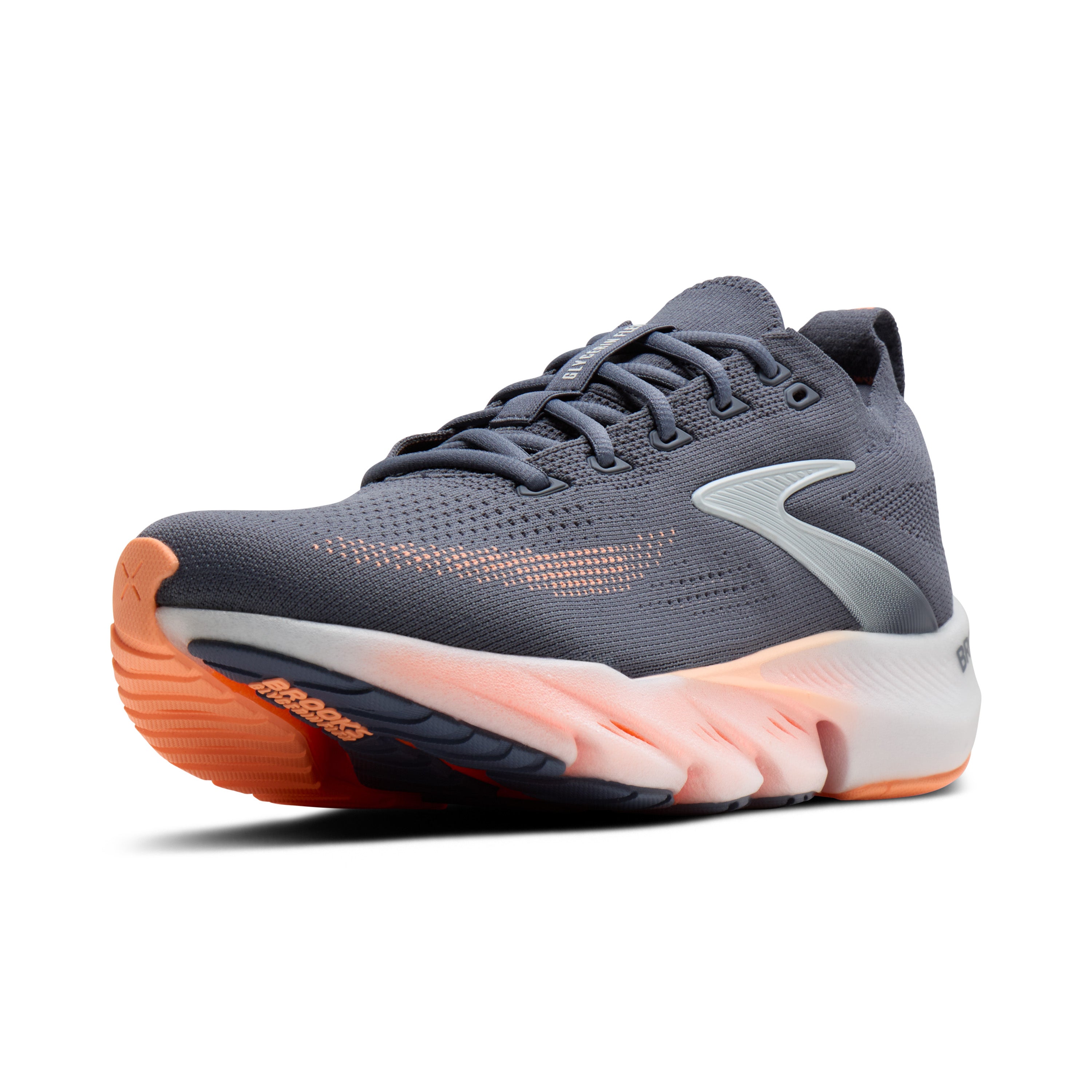 Gray running shoe with orange sole on a white background