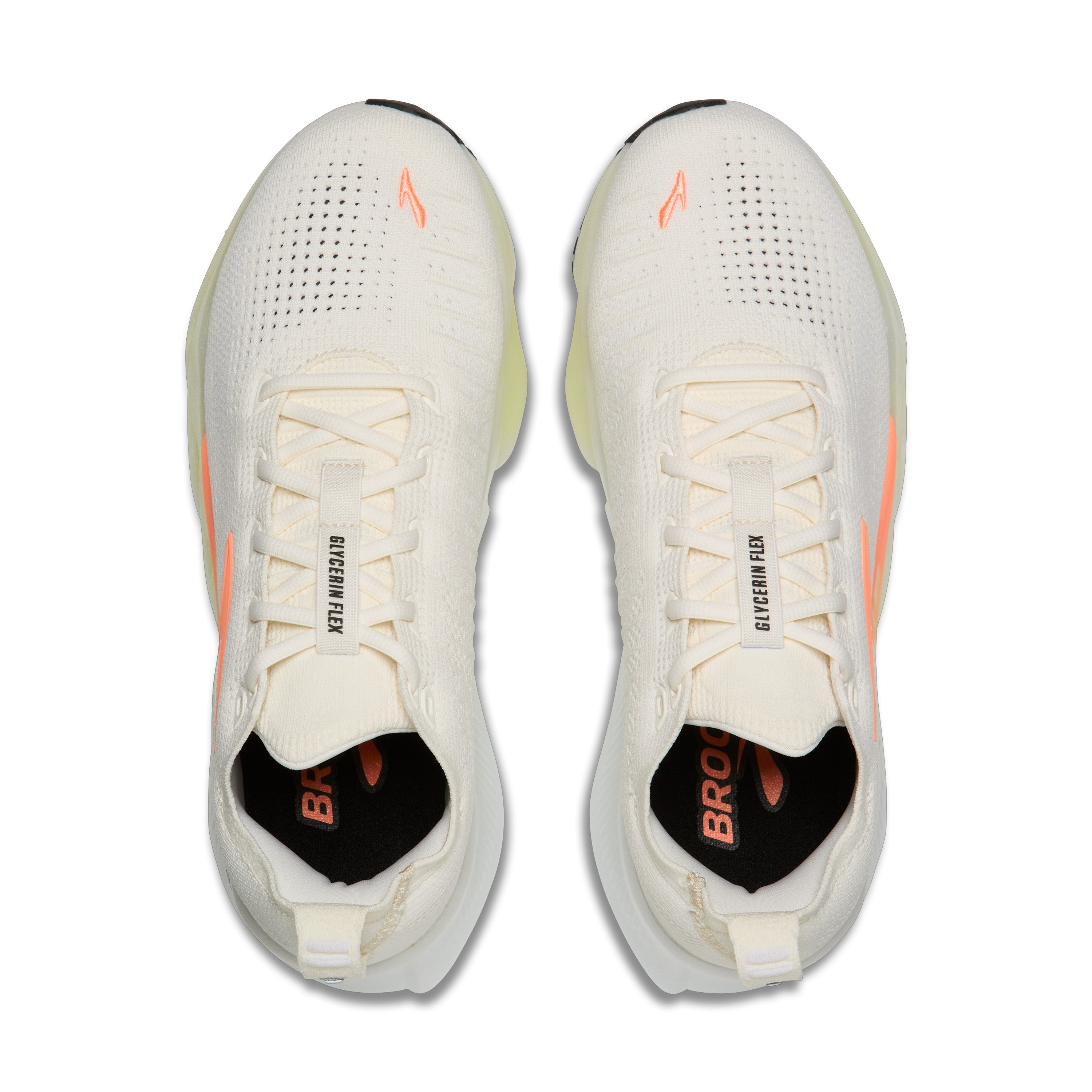 White running shoes with orange accents on a white background