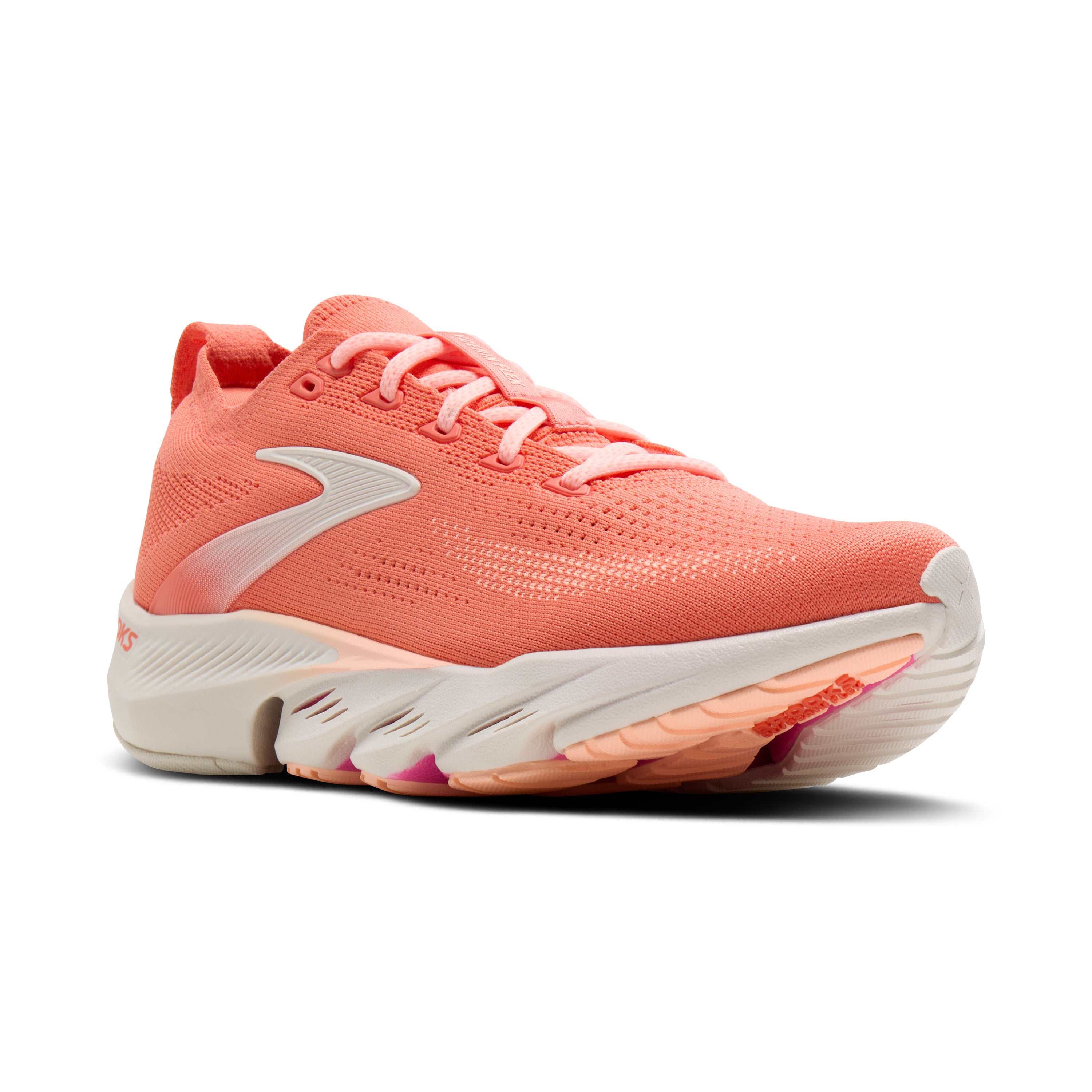 Coral running shoe with white sole on a white background