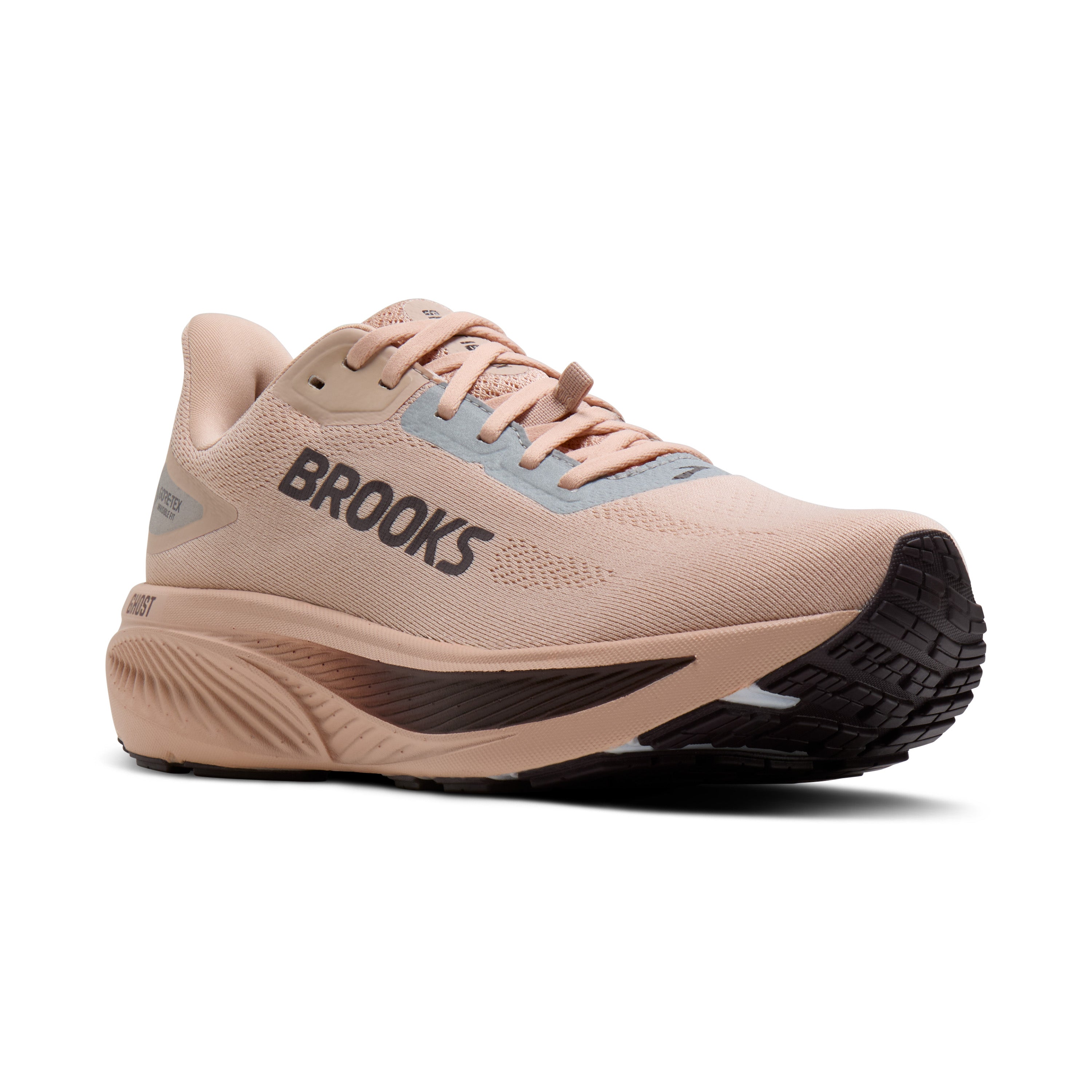 Beige running shoe with 'Brooks' branding on a white background