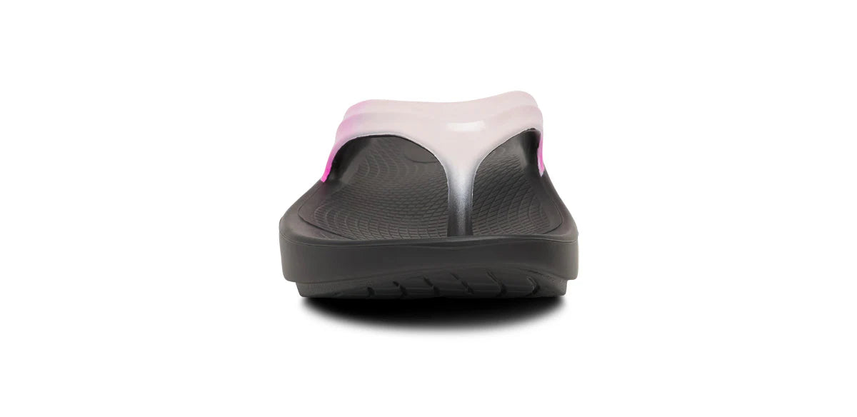 Gray sandal with pink accents on a white background