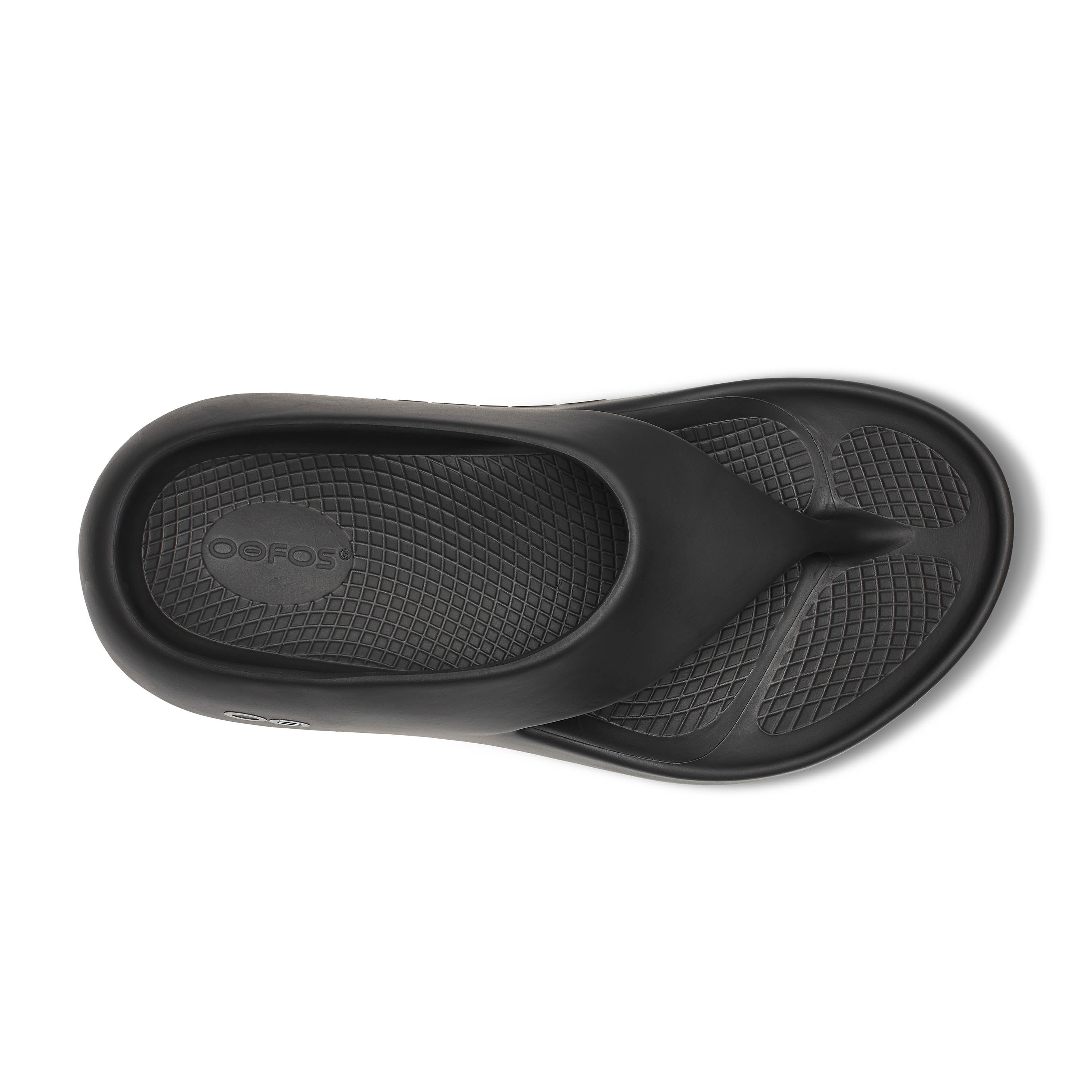 Black sandal with a textured sole on a white background