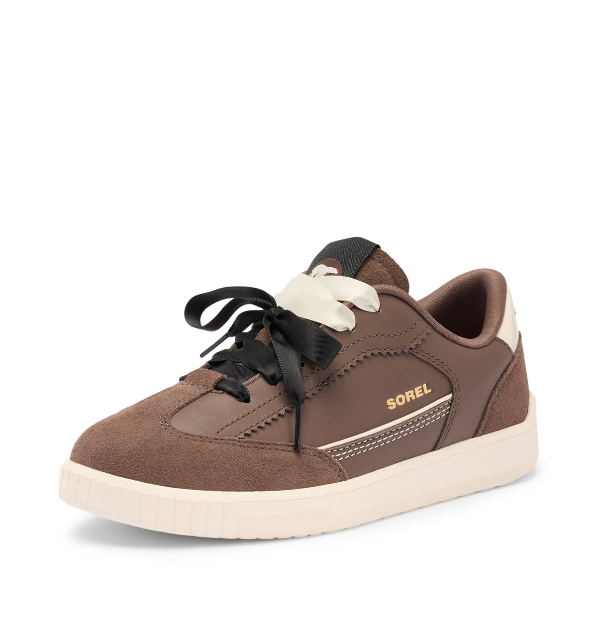 A brown suede and leather low-top sneaker with black laces, a cream-colored heel tab, and a cream midsole, featuring the brand name 'SOREL' in gold on the side.