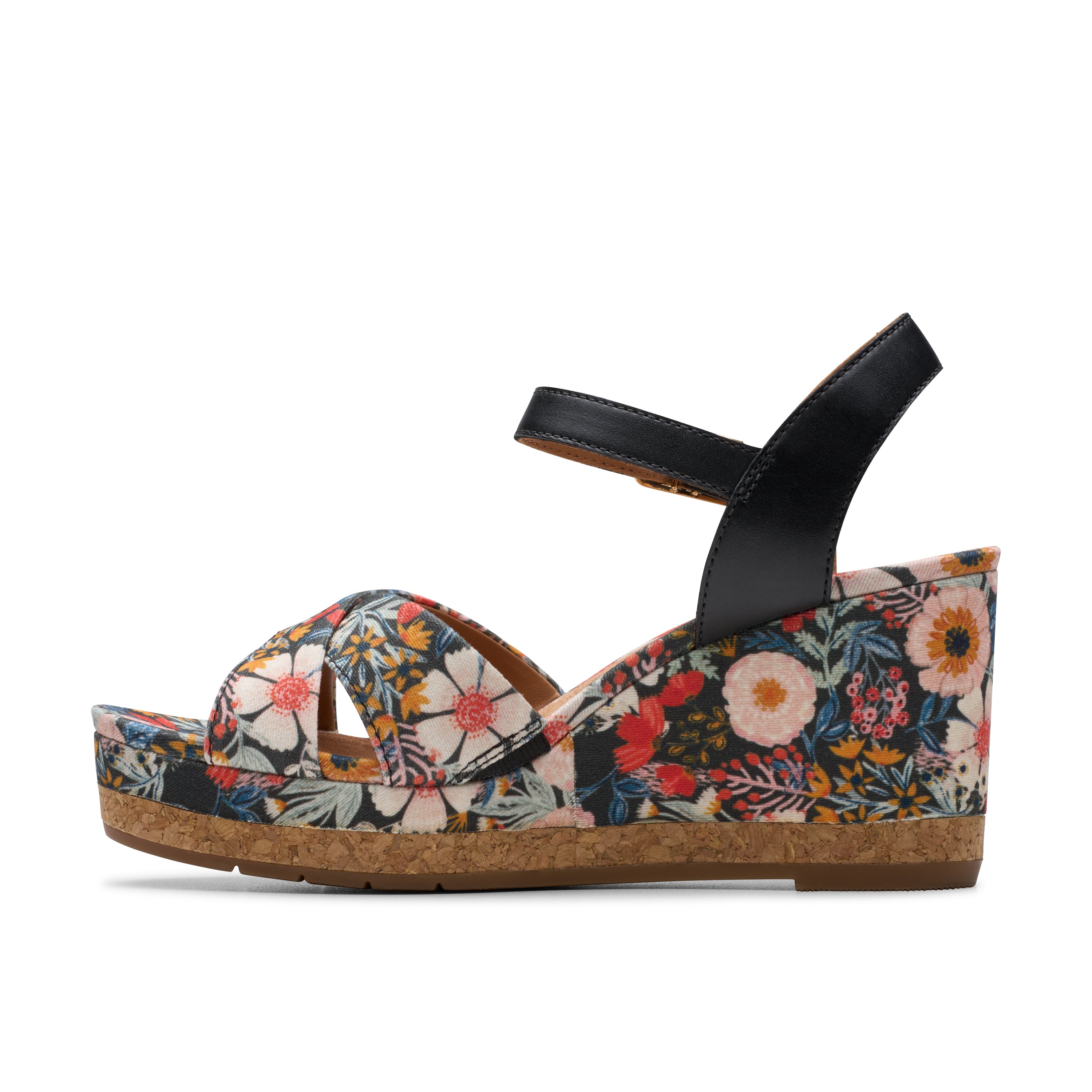 Floral wedge sandal with a black strap on a white background