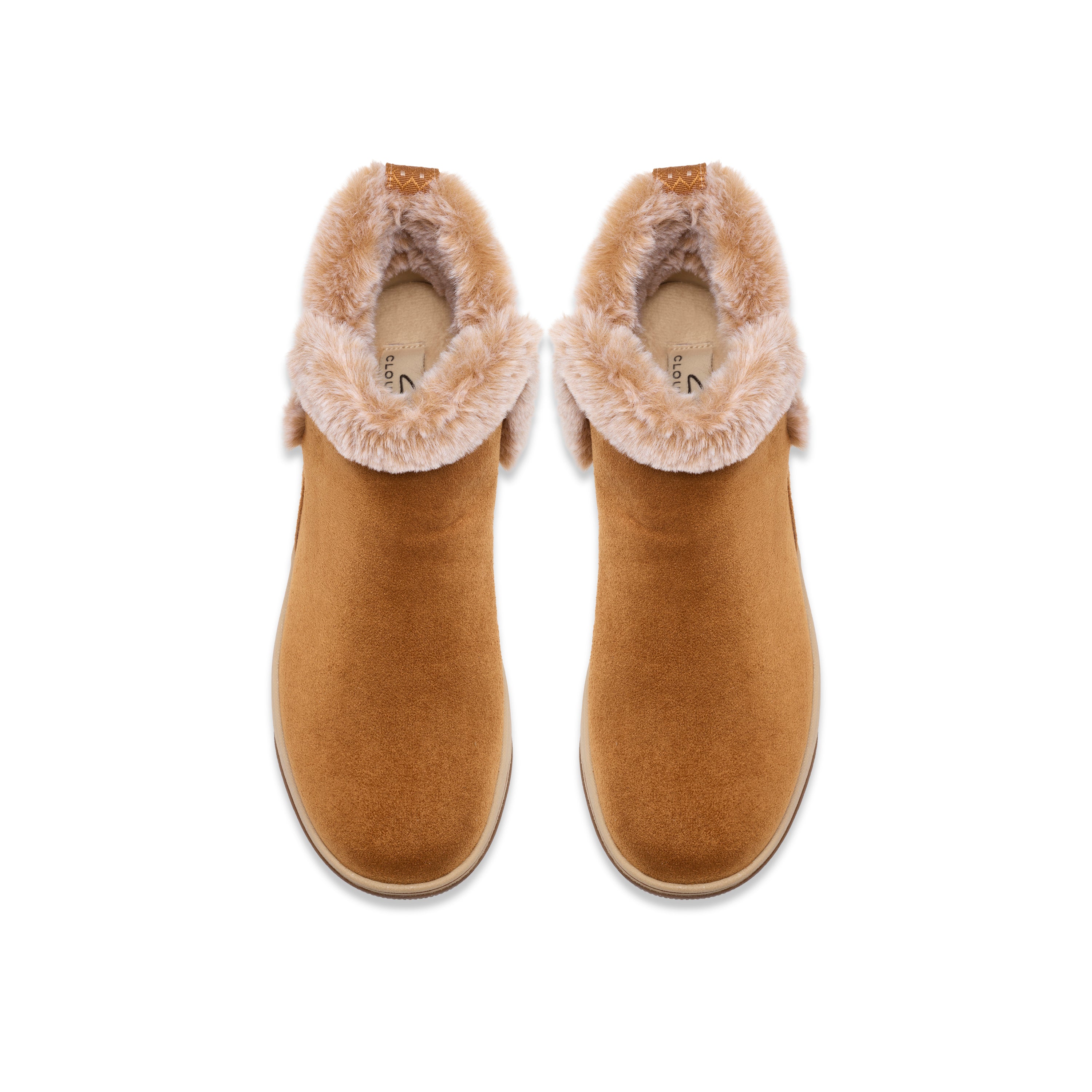 A pair of tan suede ankle boots with fluffy cream shearling lining, shown from a top-down view on a white background.