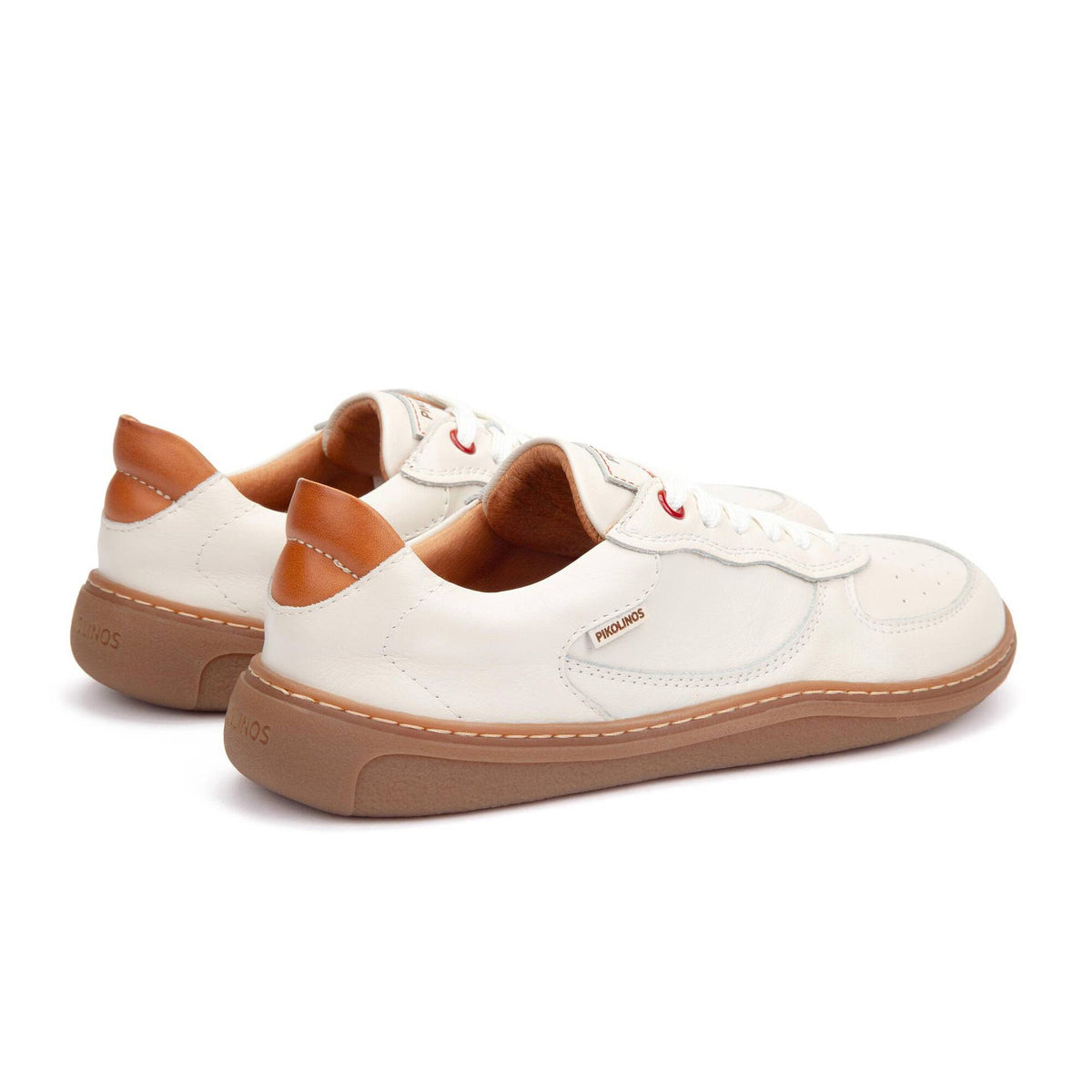 White sneakers with brown accents on a white background