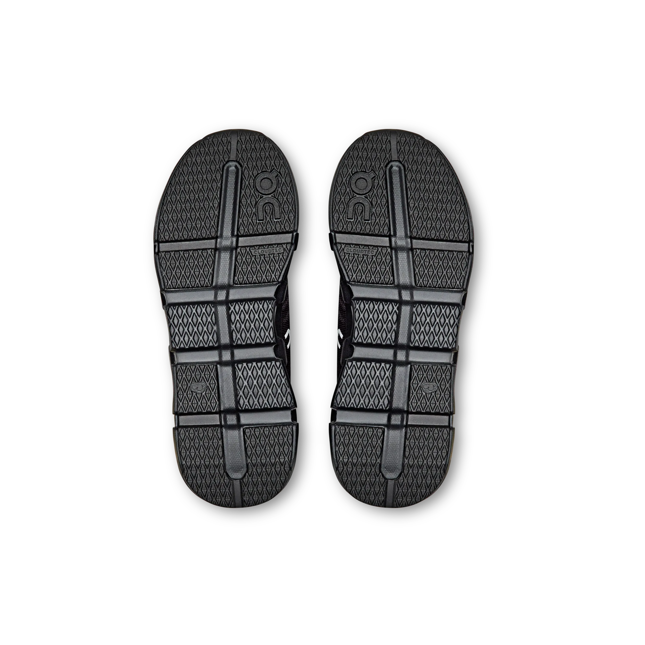 Black sandals with a textured sole on a white background