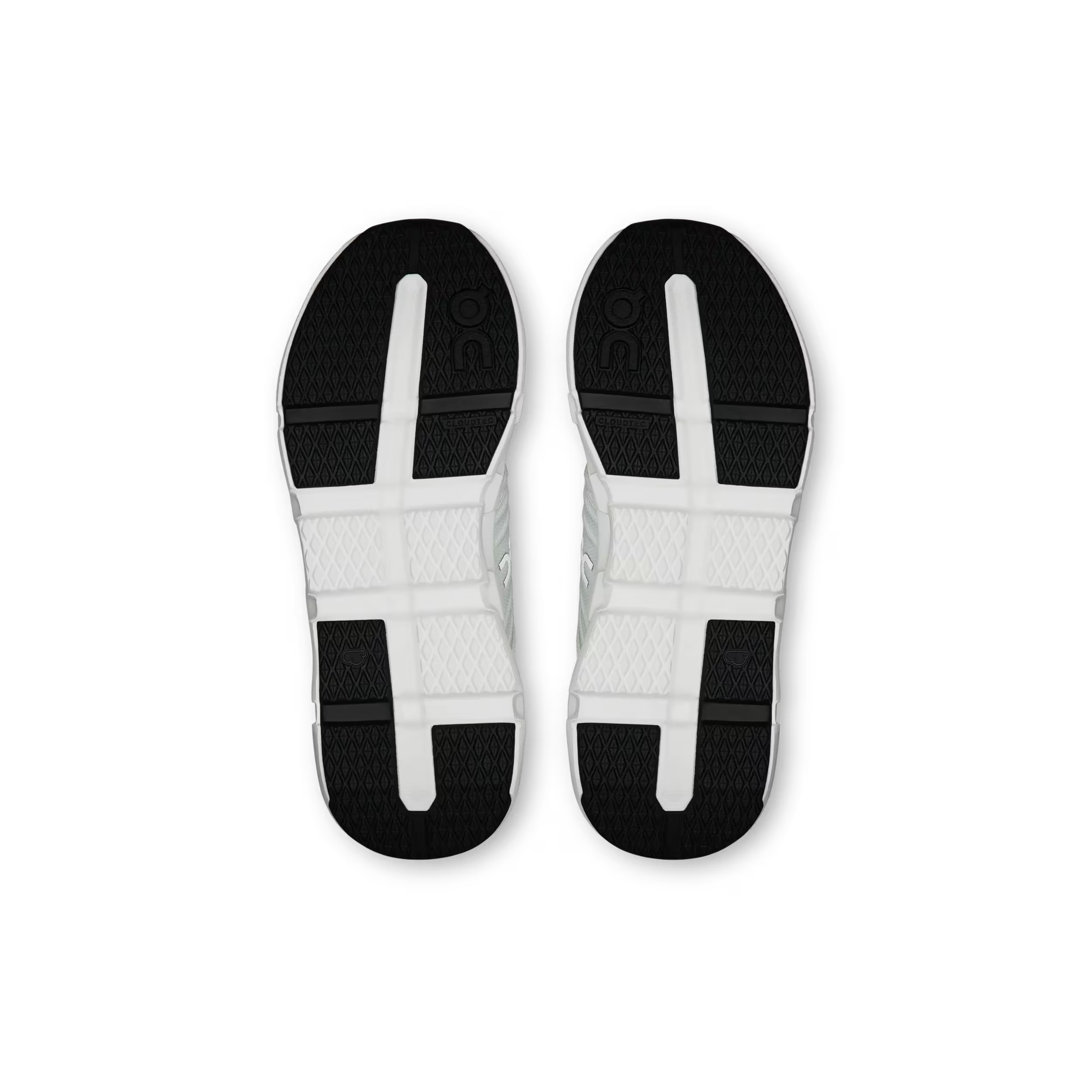 White athletic shoes with black and gray sole on a white background