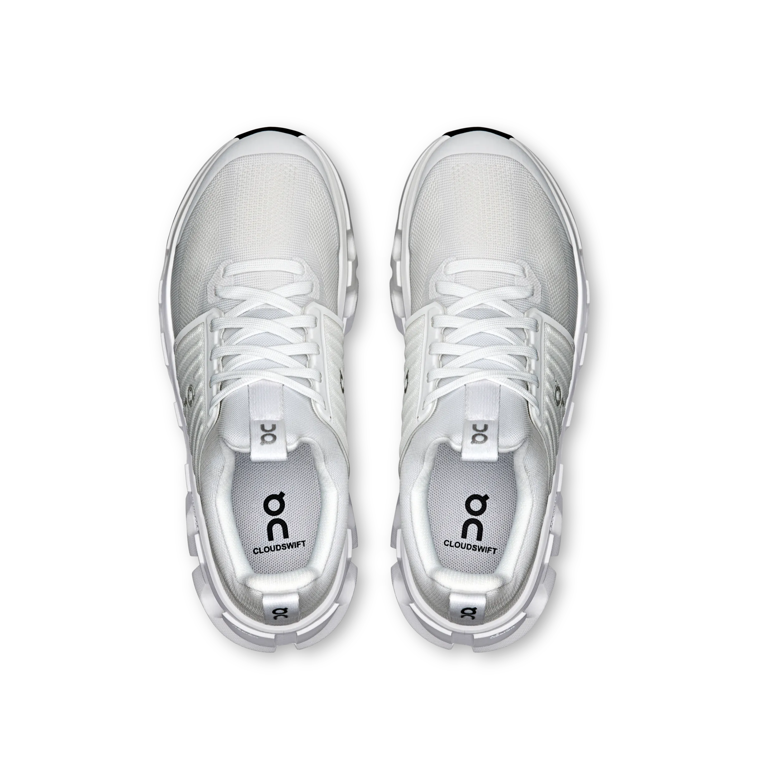 White athletic shoes with 'on' logo on a white background