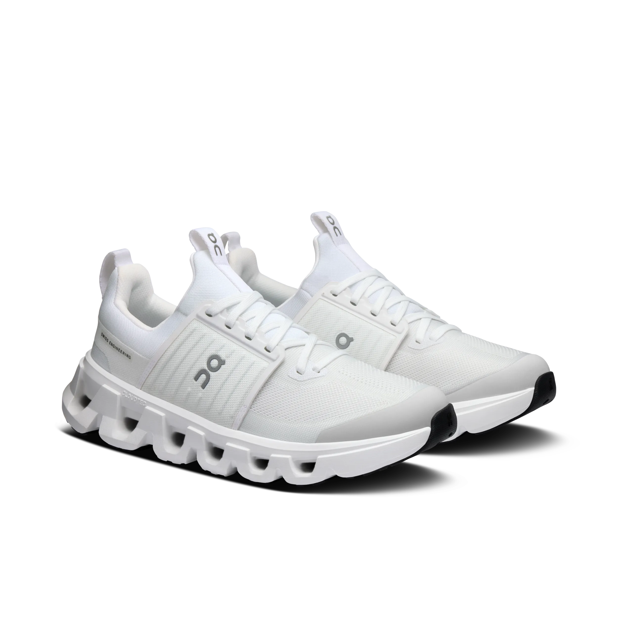 White athletic shoes with a unique sole design on a white background