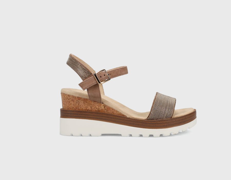 Brown wedge sandal on a light gray background