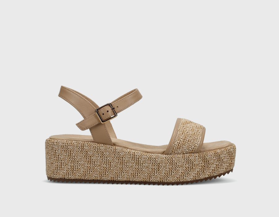 Beige sandal with a platform sole on a light gray background