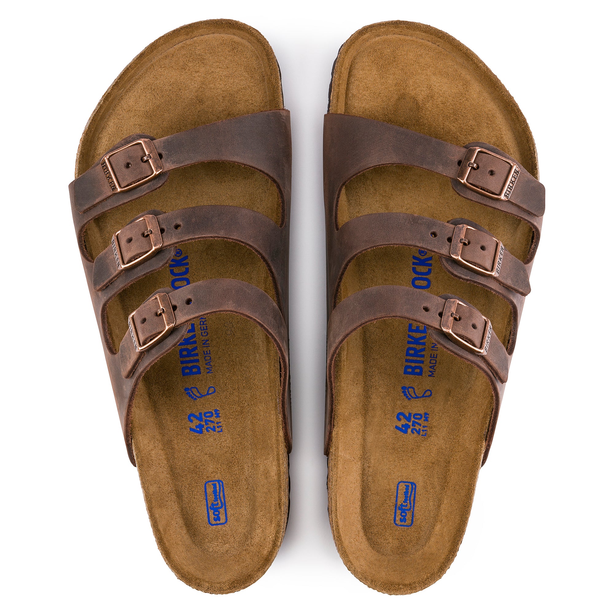 Brown sandals with multiple straps and buckles on a white background