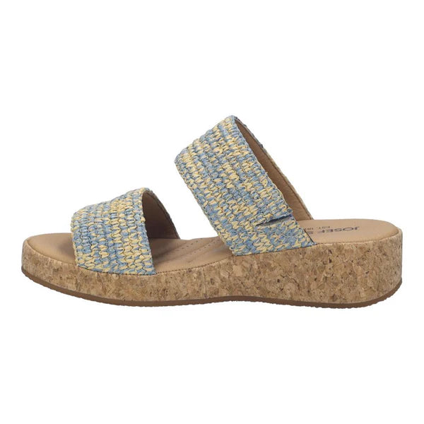 Blue woven sandal with cork sole on a white background