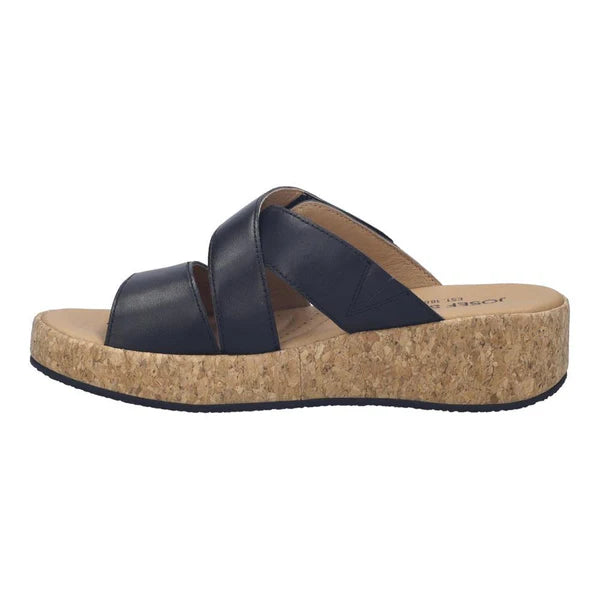 black sandal with cork platform on a white background