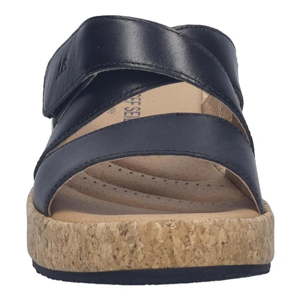 black sandal with cork sole on a white background