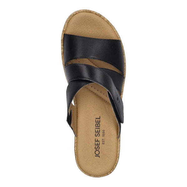 Black sandal with tan sole on a white background