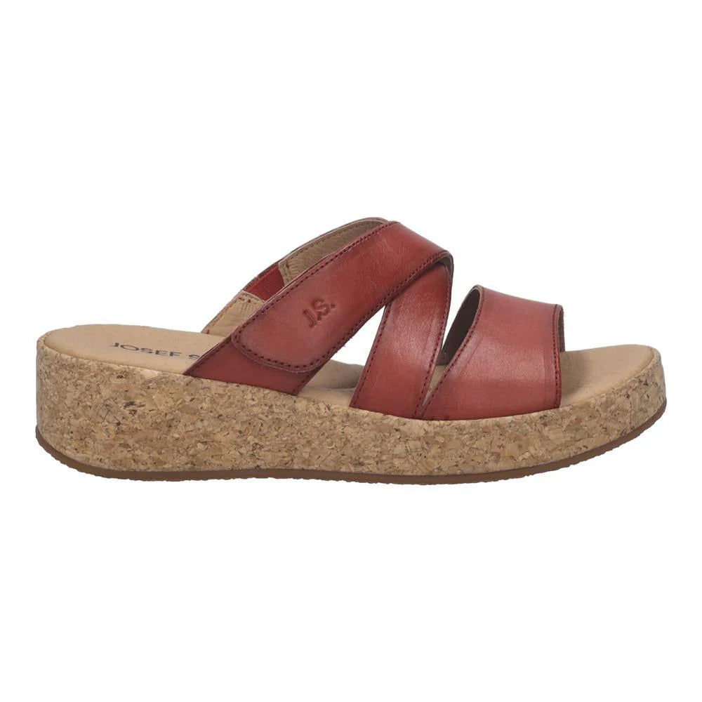 red sandal with cork platform on a white background