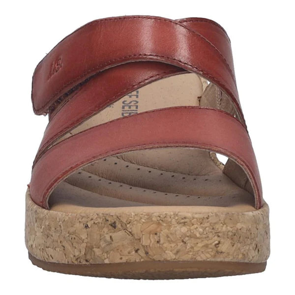 red sandal with cork sole on a white background