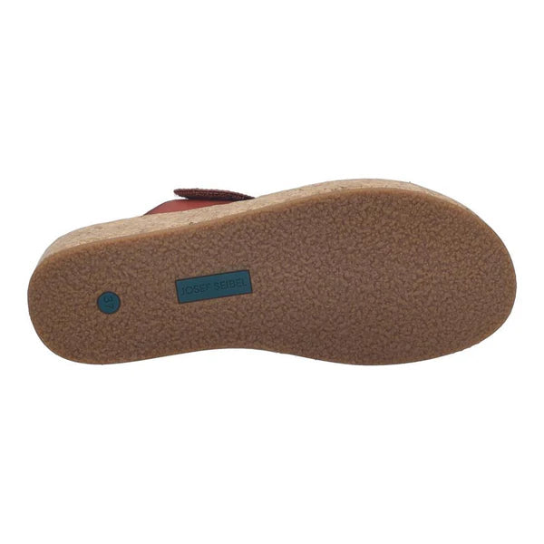 Brown sandal sole with a brand logo on a white background