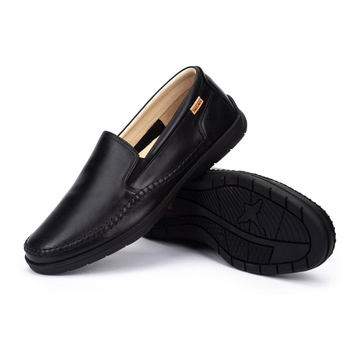 Black leather loafers on a white background
