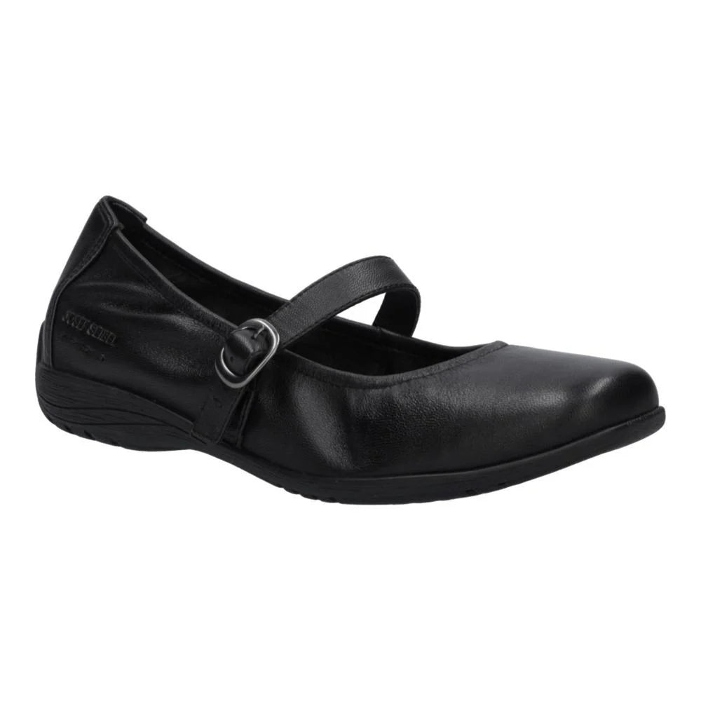A black leather Mary Jane flat shoe with a strap and silver buckle, shown from a three-quarters angle on a white background.