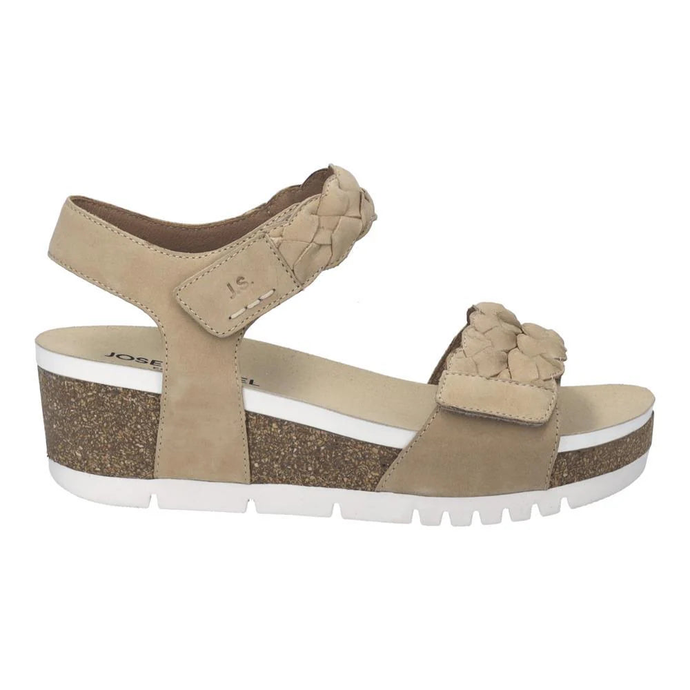 Beige sandal with cork platform on a white background