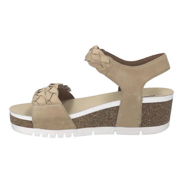 Beige wedge sandal with a white sole on a white background
