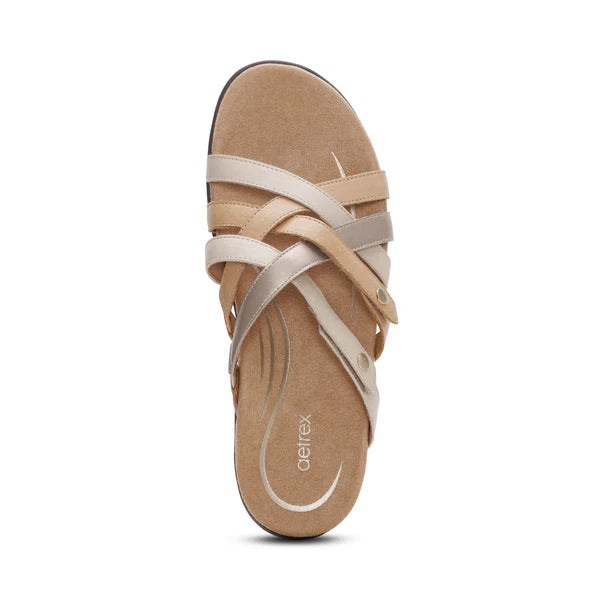 Beige sandal with multiple straps on a white background