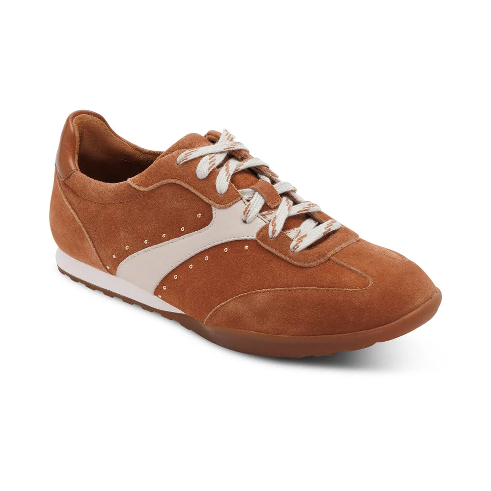 Brown sneaker with white laces on a white background