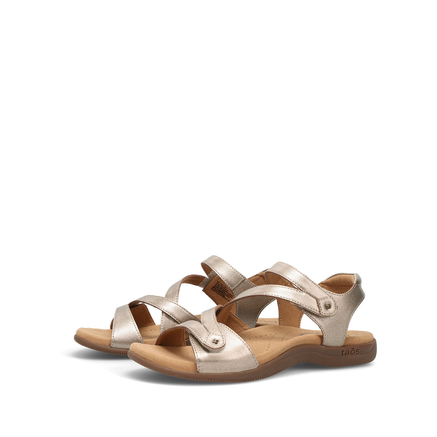 Pair of gold sandals on a white background