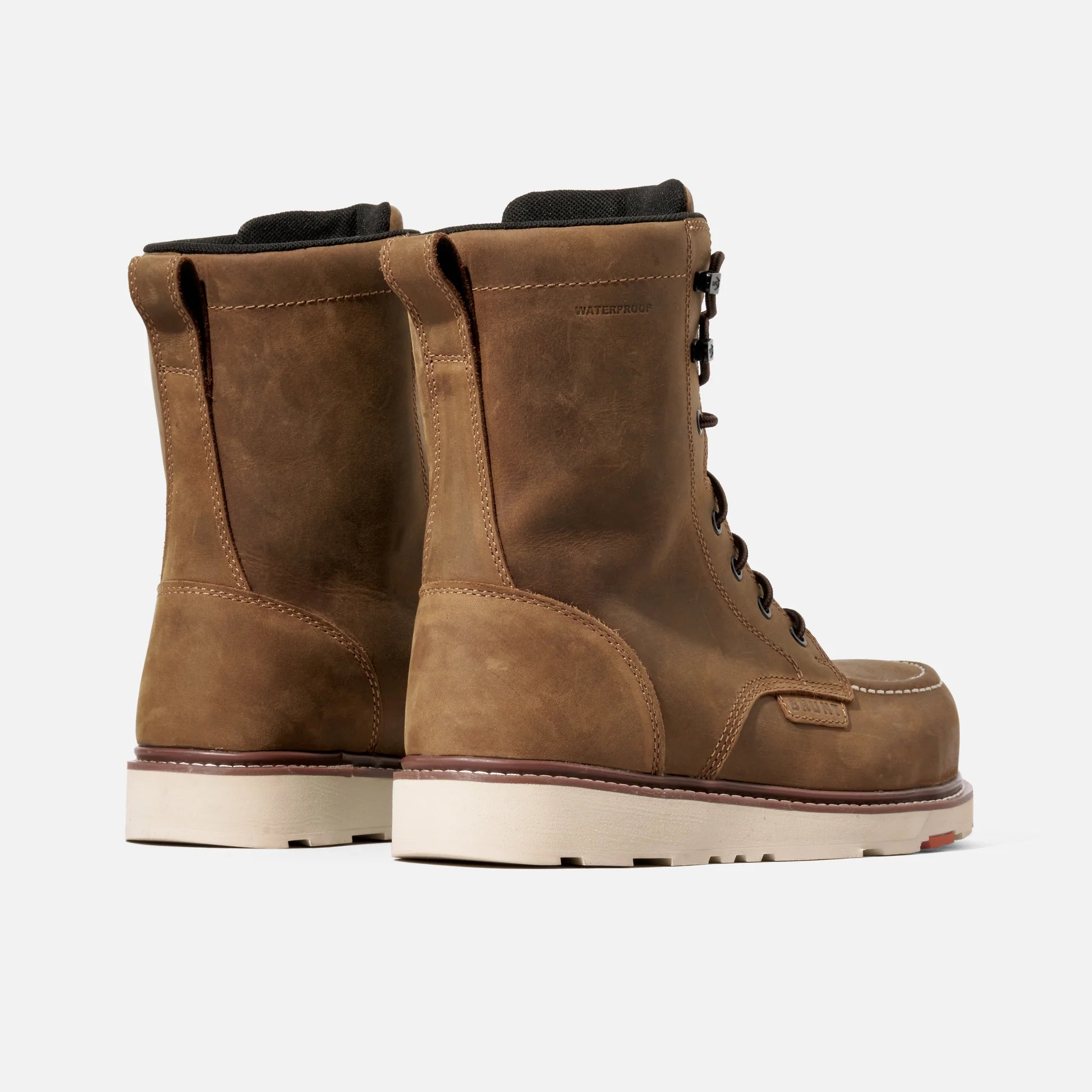 Pair of brown leather boots on a white background