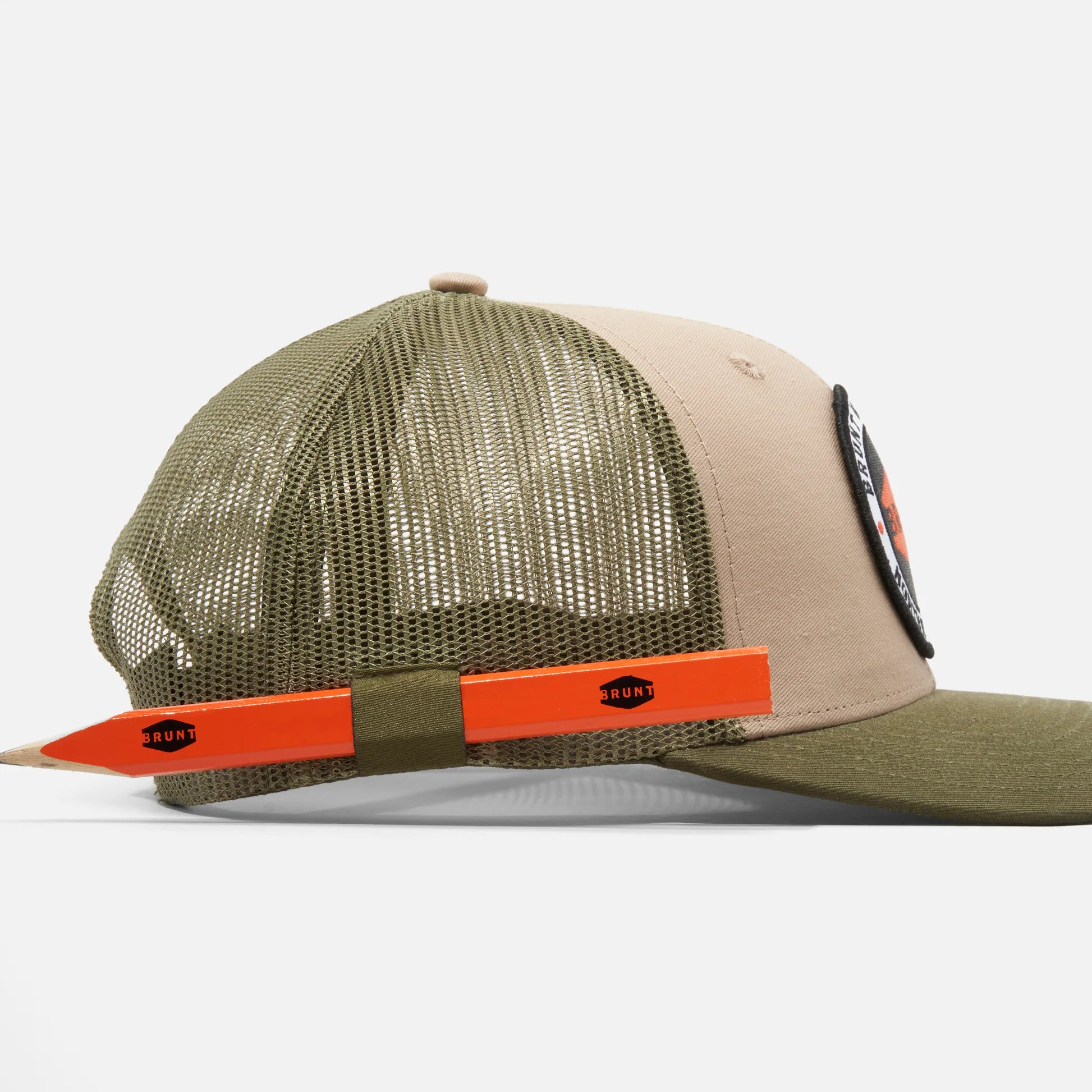Green and beige cap with orange accents on a white background