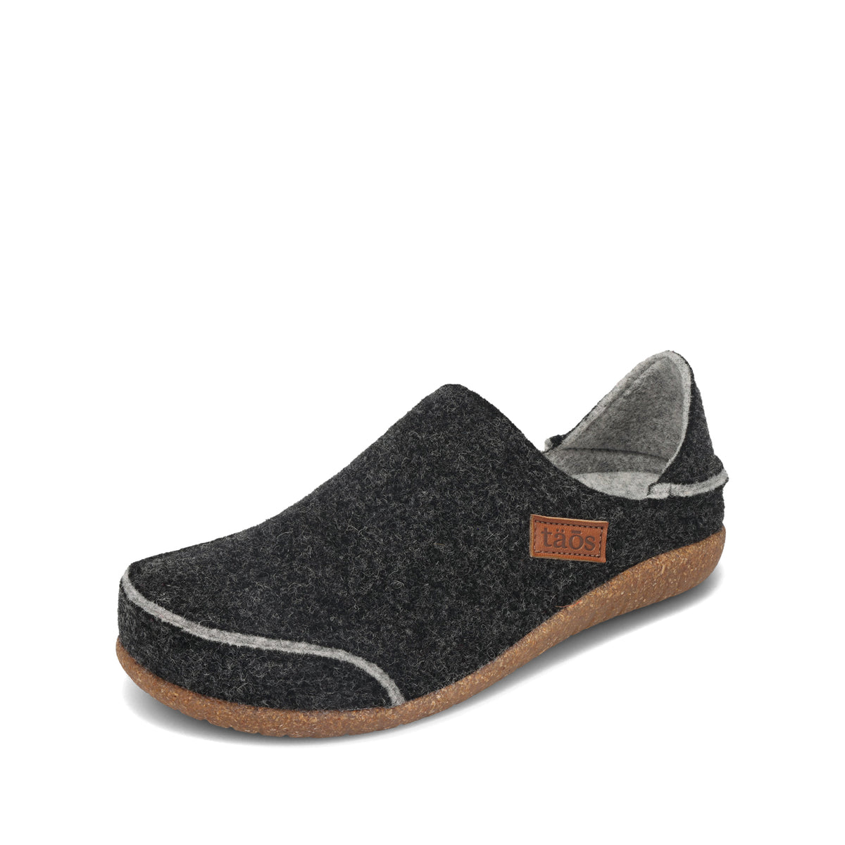 Black slip-on shoe with cork sole on a white background