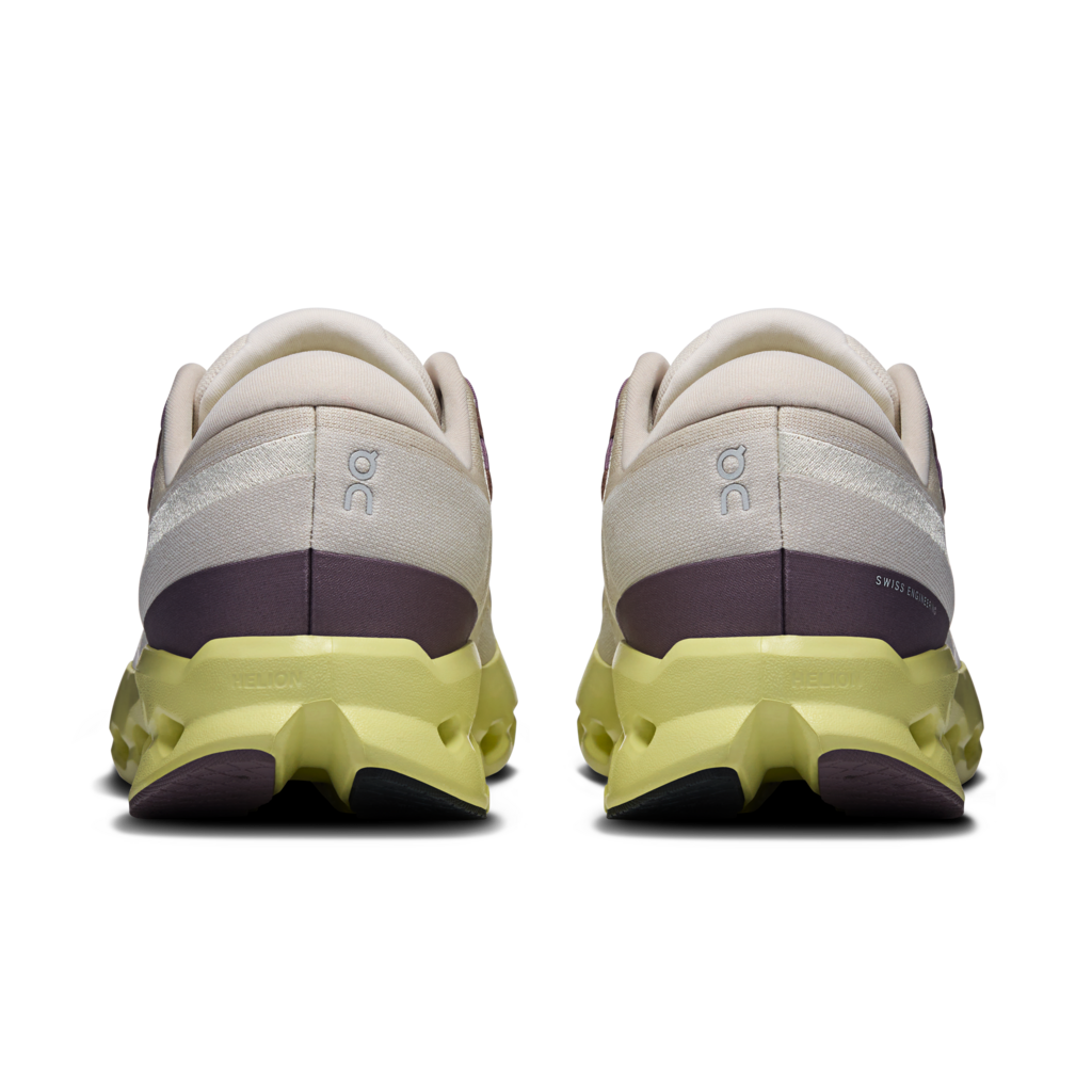 Pair of white and yellow running shoes on a transparent background