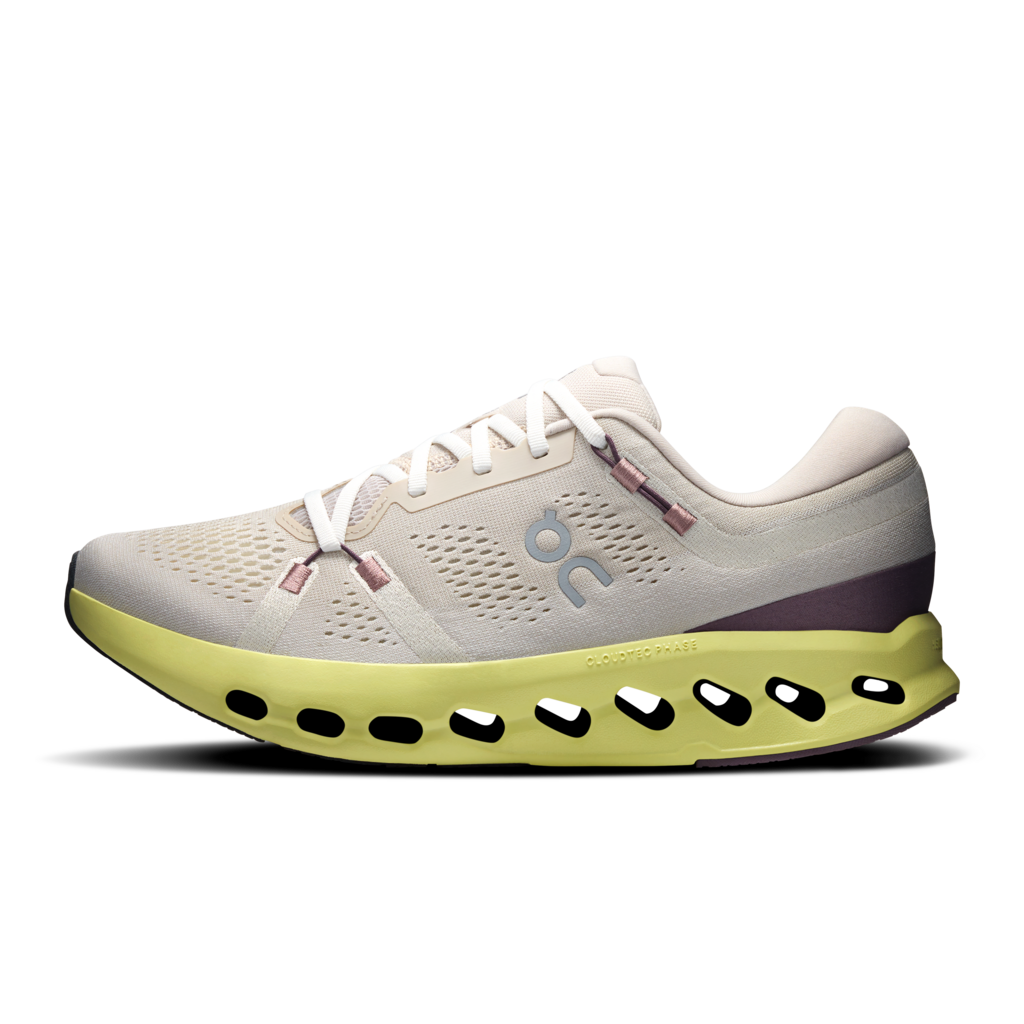 White running shoe with a green sole on a transparent background