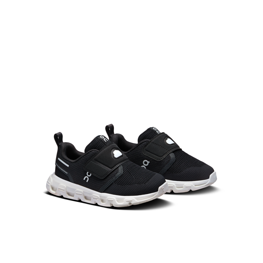 A pair of black toddler sneakers with hook-and-loop strap closures and chunky white soles, shown on a clean white background.