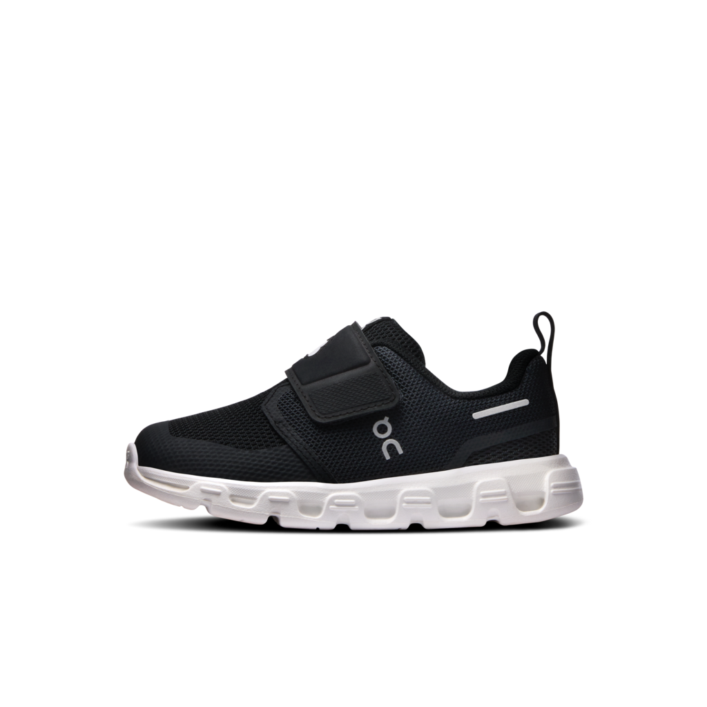 A black On brand slip-on sneaker with a hook-and-loop strap closure and a chunky white sole, shown from a side profile on a white background.